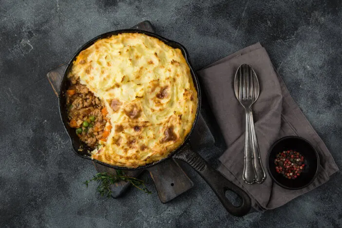 shepherd's pie. Minced meat, mashed potatoes and vegetables casserole in cast iron pan
