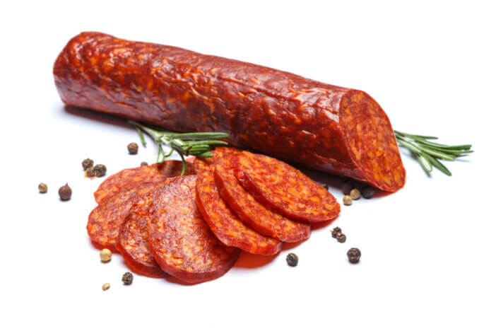 Spanish chorizo sausage on white background