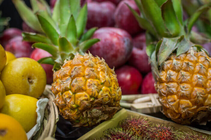 Baby pineapples at market