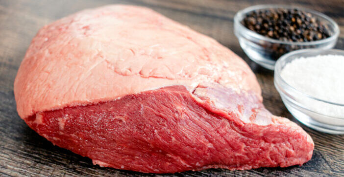 3+ Delicious Ways to Enjoy Australian Picanha 1 Whole beef picanha with kosher salt and black pepper on a wood background