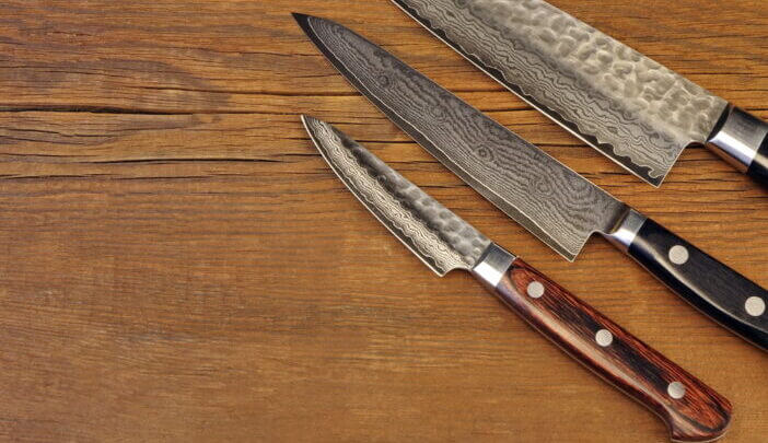 Three Japanese Professonal Kitchen Knives Set On The Grunge Rustic Table, Top View, Close Up, Copy Space