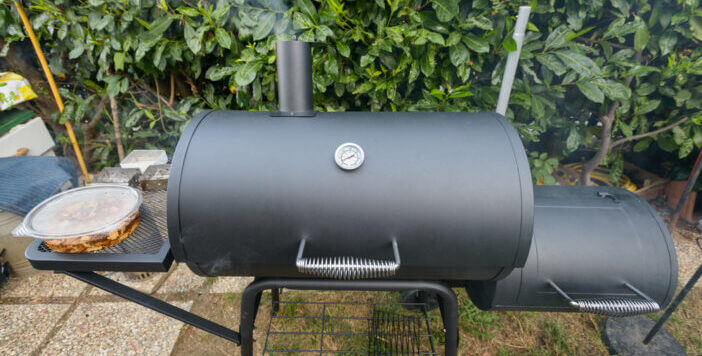 A black barbecue ready for grilling a slow cook pulled pork and ribs
