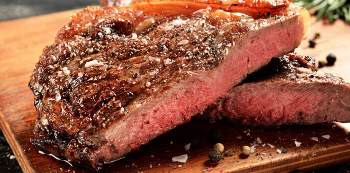 6+ Steps for Smoking a Perfect New York Strip 1 Prime Black Angus New York strip steak. Rare degree of steak doneness.