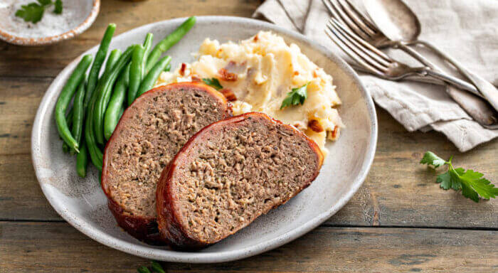 6+ Delicious Meat Bread Recipes You Have to Try 1 Meatloaf with mashed potatoes and green beans, traditional dinner meal, serving on a plate