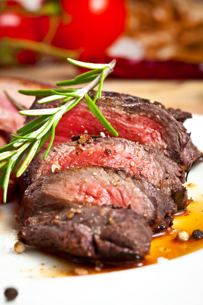 close up view of grilled venison fillet on wooden table