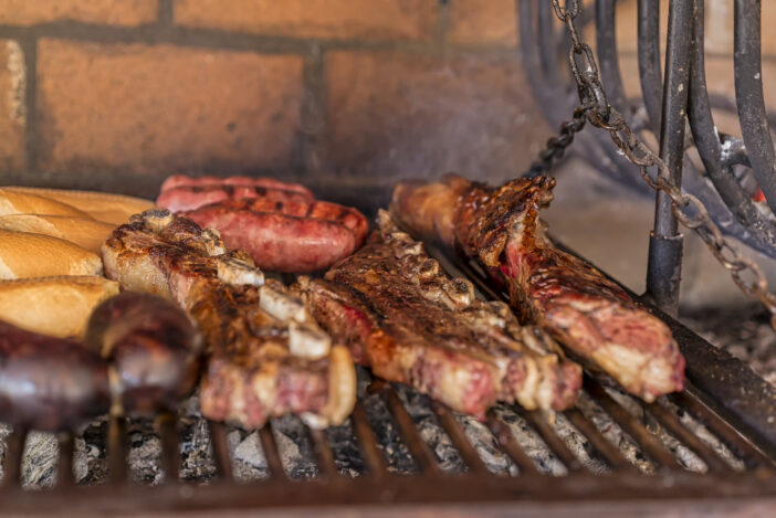 "Parrillada" Argentine barbecue make on live coal (no flame), beef "asado", bread, "Chorizo" and blood sausage "morcilla"