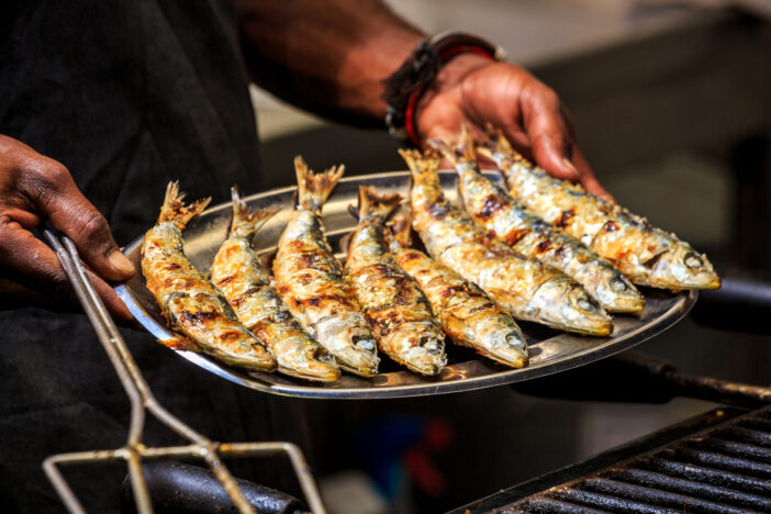 Freshly grilled sardines on silver plate