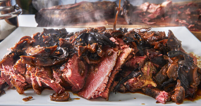 Slowly smoked beef brisket shashlik is poured with a specially prepared mushroom and onion sauce.