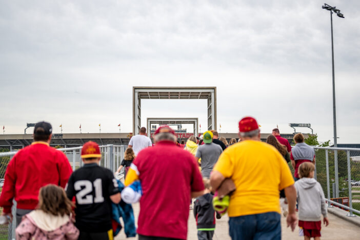 4+ Reasons You Should Invest in a BBQ Smoker Trailer 4 Ames, Iowa, USA - 9.2022 - Fans walking across the Lincoln Way elevated bridge from the tailgating lots to Jack Trice Stadium. High quality photo