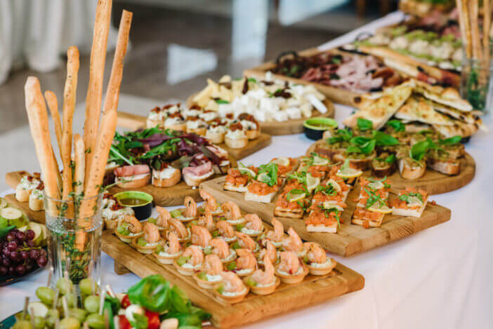Snacks set. Wooden boards plates with different delicious snacks. Appetizers table with Italian antipasti snacks. Authentic traditional Spanish tapas set.