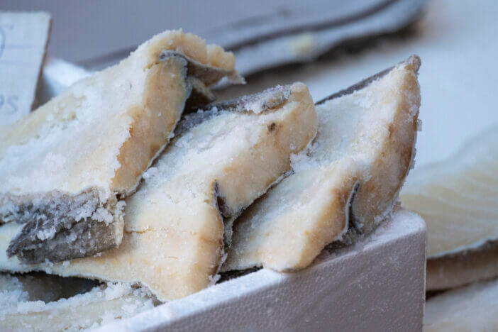6+ Key Differences Between Atlantic Cod and Black Cod 3 Some pieces of a natural and appetizing salted or salted cod cut into strips