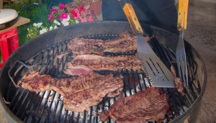 10+ Tasty Mexican Meats That Will Spice Up Your Meal 2 Mexican style beef on a charcoal grill as part of family and friends weekend reunion, home made carne asda with tortillas and beer