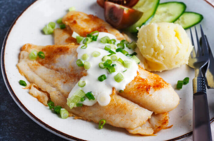 Fried Basa Fillet with sauce, mashed potato and fresh vegetables