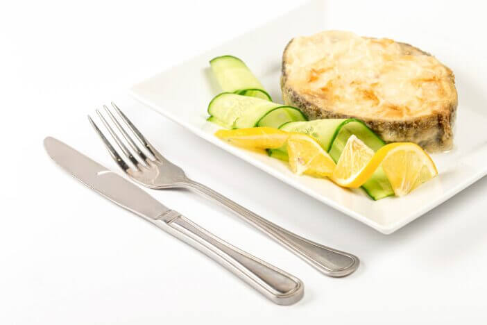 Fried escolar fish with lemon and cucumber