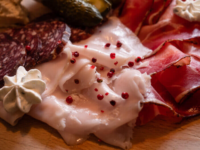 10+ Delicious Ways to Cook with Pork Fatback 4 Lardo Pork Fat, Speck and Salami Mixed Cold Cuts on a Board in Cortina d'Ampezzo, Italy, the Tagliere of Affetati Misti are a Speciality of the Dolomite Mountain Cuisine