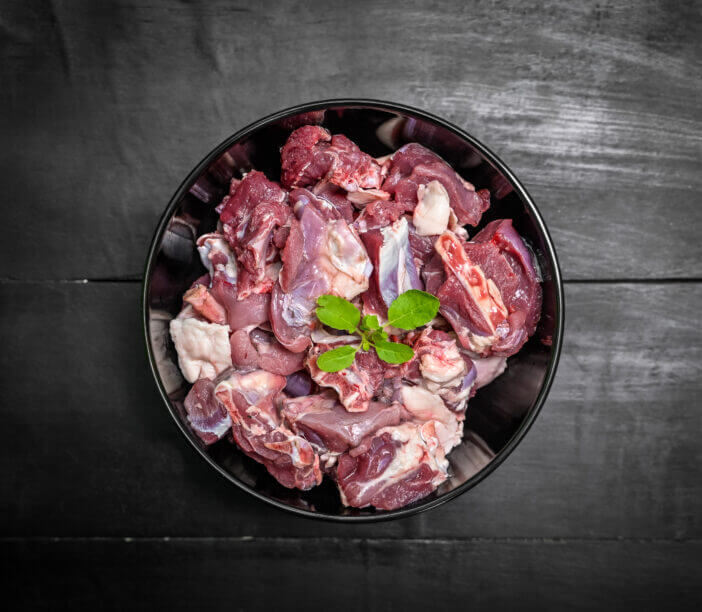 Chopped raw meat on black background , top view . raw Lamb and mutton meat isolated.