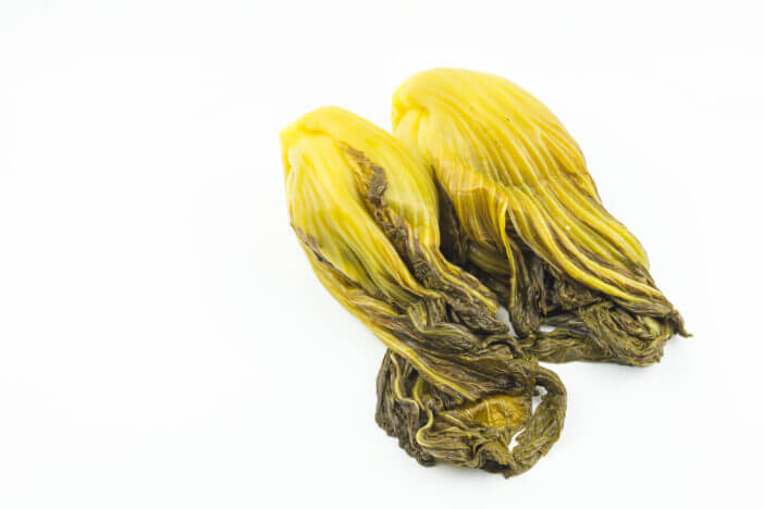 pickled chinese mustard isolated on white background