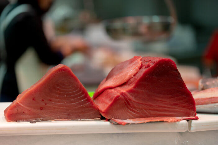 Fresh tuna fish fillet on a fish market shelf