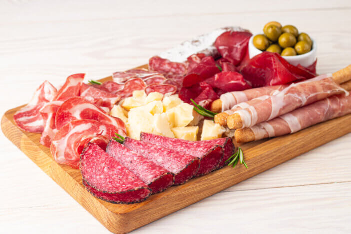 11 Gourmet Meat Gift Sets For This Holiday Season 9 Charcuterie board. Antipasti appetizers of meat and cheese platter with salami, prosciutto crudo or jamon and olives