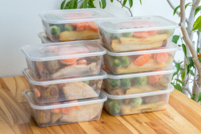 10 High Protein Meat Delivery Options For Health & Fitness Enthusiasts 2 Meal prep. Stack of home cooked roast chicken dinners in containers ready to be frozen for later use.