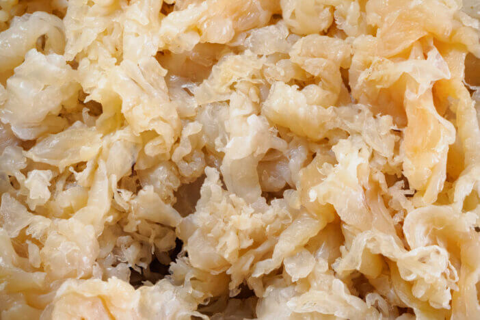 7 Uses for Exotic Meat Cuts For Foodies & Culinary Adventurers 4 Raw salted fresh jellyfish ready to cook for traditional local Chinese food. jellyfish seafood in asian local stall fish market.