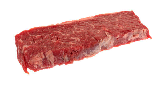 9 Lean Grass Fed Beef Cuts For Health & Fitness Enthusiasts 3 A single raw beef loin sirloin grilling tip isolated on a white background.