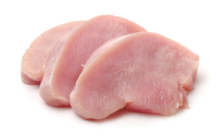 11 Low Fat Meat Options For Health & Fitness Enthusiasts 3 Slices of raw turkey meat fillet isolated on white